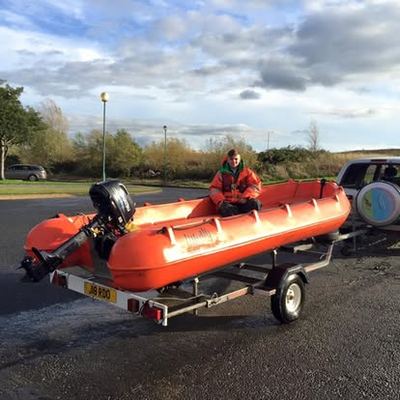 Orange rescue boat on its trailer, ready to mobilise